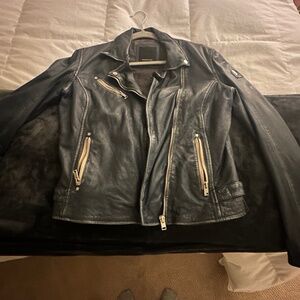 Only worn once beautiful dark blue leather jacket